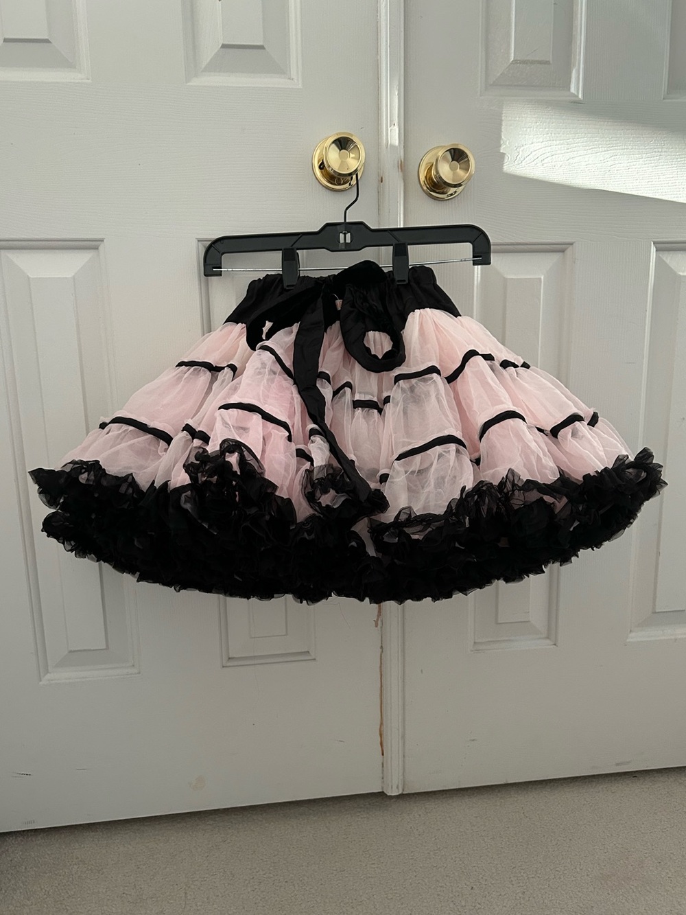 Kaiya eve pink pettiskirt with black ruffles and black ribbon binding size 8